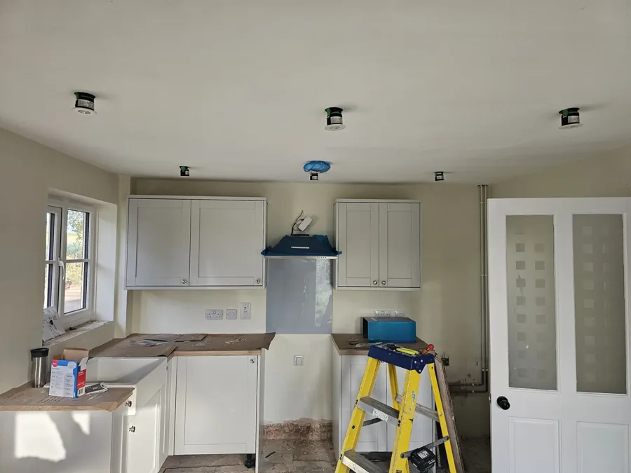 Electrical work in progress during a kitchen renovation